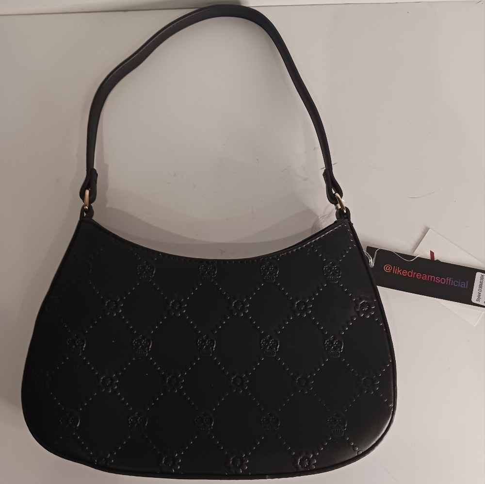 Black skulls purse.  Faux leather shoulder purse.